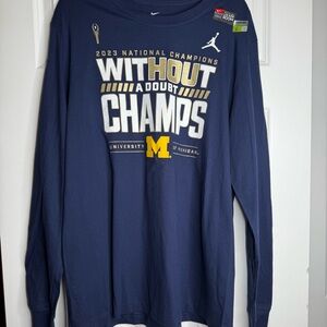 Nike Blue and Yellow Michigan 2023 National Champions Short Sleeve Bold Text